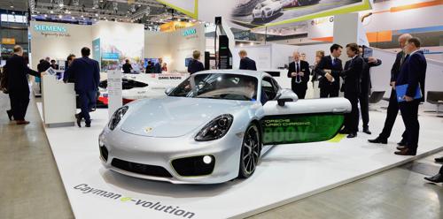 Porsche electrifies the Cayman for International Electric Vehicle Symposium