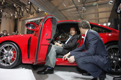Arnold Schwarzenegger visits the Porsche stand at Geneva Motor Show